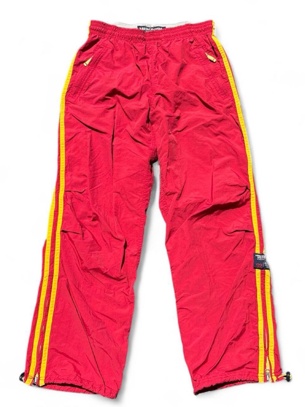 Y2K vintage Abercrombie red track pants with yellow stripes down the sides